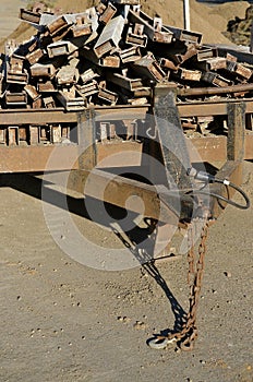 Trailer loaded with old rusty concrete forms