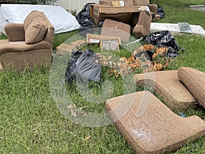 Trailer park eviction household items put on curb close up