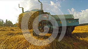 Trailer Of Tractor Making Bales Of Hay