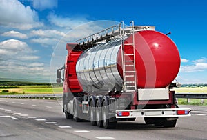 The trailer transports cars on the highway