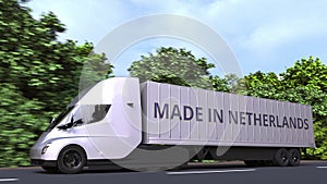 Trailer truck with MADE IN NETHERLANDS text on the side. Dutch import or export related 3D rendering