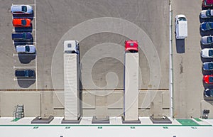 Trailers at docking stations of a distribution center waiting to be loaded