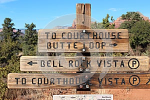 The trailhead sign for the Courthouse Butte Loop, Bell Rock Vista and Courthouse Vista made of wood in Sedona, Arizona