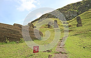 Trails on the slope of Rano Raraku volcano leading to a large group of abandoned huge Moai statues, Easter island, Chile