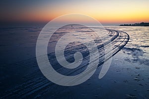 Trails on the surface of frozen lake. Winter Landscape