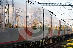 Train arrival: outside view of modern compartment carriage for suburban or regional travel transport