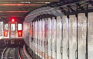 train arrives in the underground station in New York