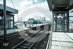 Train arriving station in retro colors