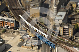 Train on a bridge in London, tilt-shift effect