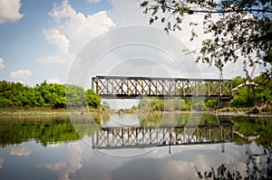 Train bridge reflected in the river