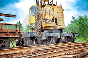 A train car sits atop train tracks, seemingly disconnected from the rest of the train