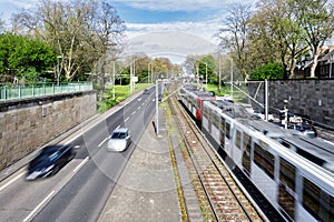 train and car traffic in motion blur