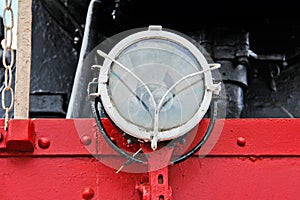 Train close up. Part of an old train. Train headlight
