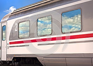 Train with cloud reflections photo