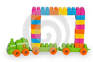 Train of colorful childrens building bricks with frame