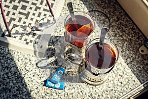Train compartment with tea and cup holders.