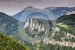 Train crosses tunnel and viaduct on Semmering railway Austria