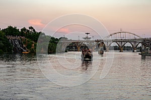 A train crossing a bridge over a body of water