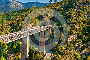 Train crossing Eiffel Viaduct in Vecchio Corsica