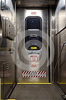 Train door with warning signs