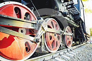 Train drive mechanism and red wheels of an old soviet steam locomotive