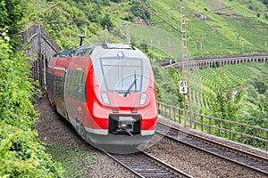 Train driving along german river Moselle