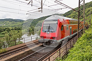 Train driving along german river Moselle