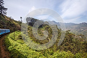 Train from Ella to Kandy among tropical mountains. Sri Lanka