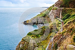 Train exiting a tunnel. View from Cliff Walk Bray to Greystones, Ireland