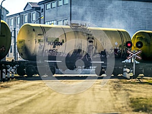 Train with gasoline tank goes by the rail