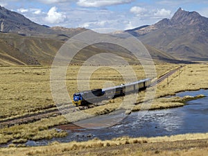 Train goes through Altiplano, Puno Region, Peru