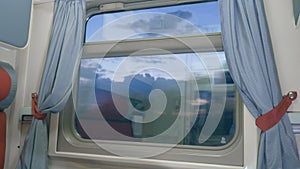 A train goes in the evening, view of an empty coupe.