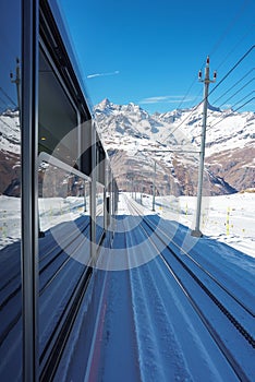 The train of Gonergratbahn running to the Gornergrat station and Stellarium Observatory