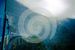 Train between haze and rain