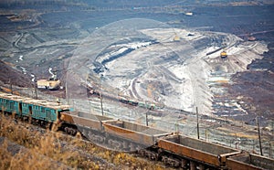 Train at the iron ore opencast mine is going for loading iron
