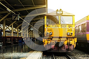 Train led by Old yellow Diesel Electric locomotives.