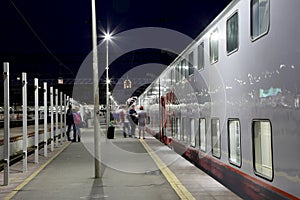 Train on Leningrad railway station at night -- is one of the nine main railway stations of Moscow, Russia