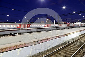 Train on Leningrad railway station at night -- is one of the nine main railway stations of Moscow, Russia