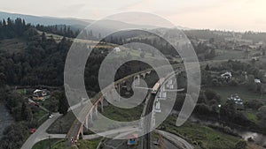 The train is mooving by rail.