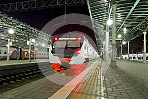 Train on Moscow passenger platform at night (Belorussky railway station) is one of the nine main railway stations in Moscow