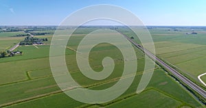 Train Moving Between Vast Green Fields, Typical Dutch Landscape - Friesland, The Netherlands, 4K Drone Footage