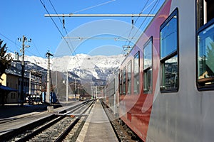 Train N snow capped mountains
