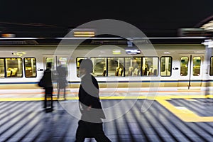 train at night at a train station in Japan