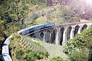 The train on the Nine Arches Bridge Demodara is one of the most famous bridges in Sri Lanka