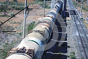 Train with oil tanks moving. Transportation of fuel on the railroad.