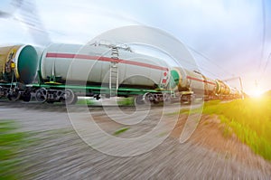 Train with oil tanks moving. Transportation of fuel on the railroad. Motion blur