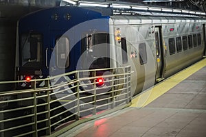 Train parked in at a dock before leaving at Grand Central Station in Manhattan photo