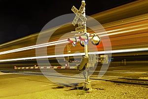 Train passes the railroad crossing with speed