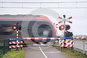 A train passes a railway crossing at high speed