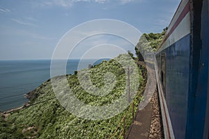 Train passes the sea, the hills, and jungle at the Hai Van Pass between Hue and Da Nang in Central Vietnam